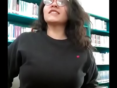 Desi Girl flashing bumpers in library in front of camera