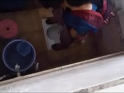 Desi college girl peeing caught in bathroom hidden camera